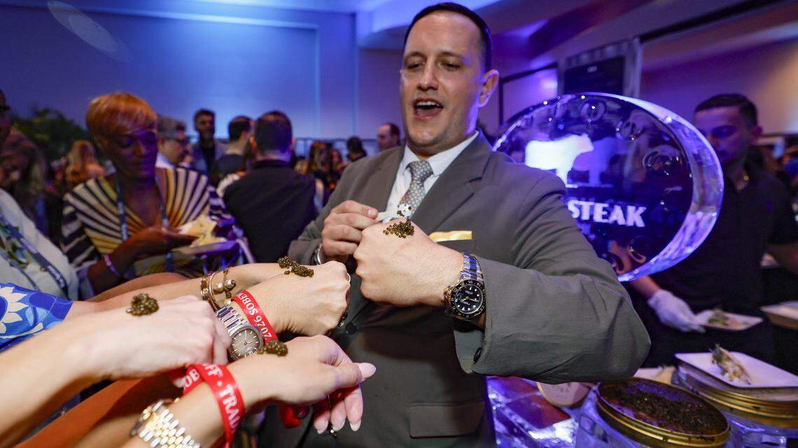 Bourbon Steak’s Assistant General Manager Christian Rodriguez serves caviar on the back of attendees hands as the Fontainebleau Miami Beach presents Wine Spectator's Best of the Best with 60 of the nation’s most acclaimed chefs and more than 65 of the world’s premier wineries at the resort hotel on Friday, February 20, 2026.