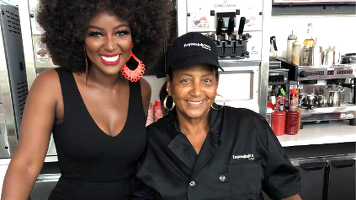 Amara La Negra supporting her mother at the opening of Happy Place Donuts, where Mami Ana has her Empanadilicious empanadas for sale.