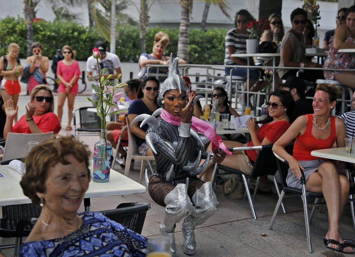 “Missy Meyakie Lapaige,” whose real name is Cornelius Boothe, does her act for the crowd during the drag show at Sunday brunch at the Palace Bar on Ocean Drive in Miami Beach on Sunday, June 10, 2012.