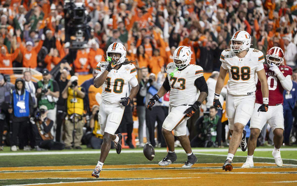Miami Hurricanes wide receiver Malachi Toney (10) scores against the Indiana Hoosiers in the second half of their College Football Playoff National Championship Game at Hard Rock Stadium on Monday, Jan. 19, 2026, in Miami Gardens, Fla.