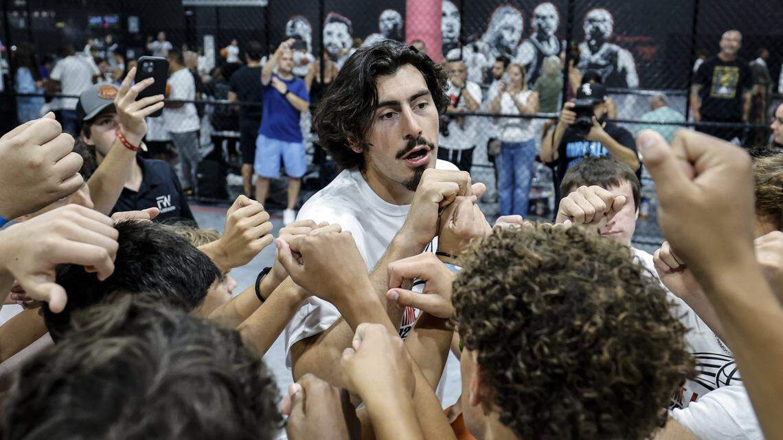 Miami Heat forward Jaime Jaquez Jr. in the huddle at his youth basketball camp at Game Point Miami, in Hialeah, Florida, on Saturday, August 16, 2025. 