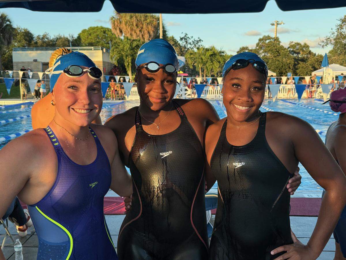 (From left to right): Fort Lauderdale High’s Katherine Voet, D’Ziah German, Da’Jah German finish in the top three places in the 500-freestyle at the BCAA swimming championships on Saturday at Plantation Aquatic Center. Da’Jah German was first, D’Ziah German was second and Voet was third.