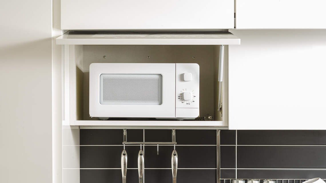 Is it safe to use kitchen appliances inside an appliance garage? Why ventilation and fire safety matter