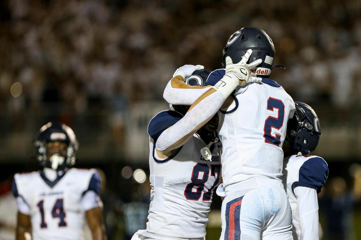 Columbus Explorers wide receiver Aj Arellano (2) celebrates with Columbus Explorers tight end Benjamin Blackburn (87) after scoring a touchdown during the first half of a high school football game against the Palmetto Panthers at Tropical Park in Miami, Florida, Friday, September 16, 2022.