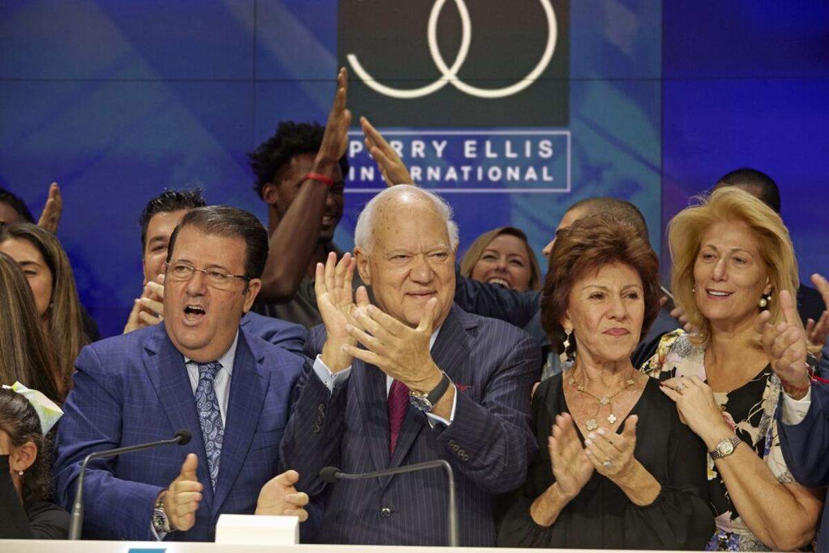 George Feldenkreis, center, his son, Oscar, left, wife Mariita, and his daughter, Fanny, right, at the New York Stock Exchange for Perry Ellis International.