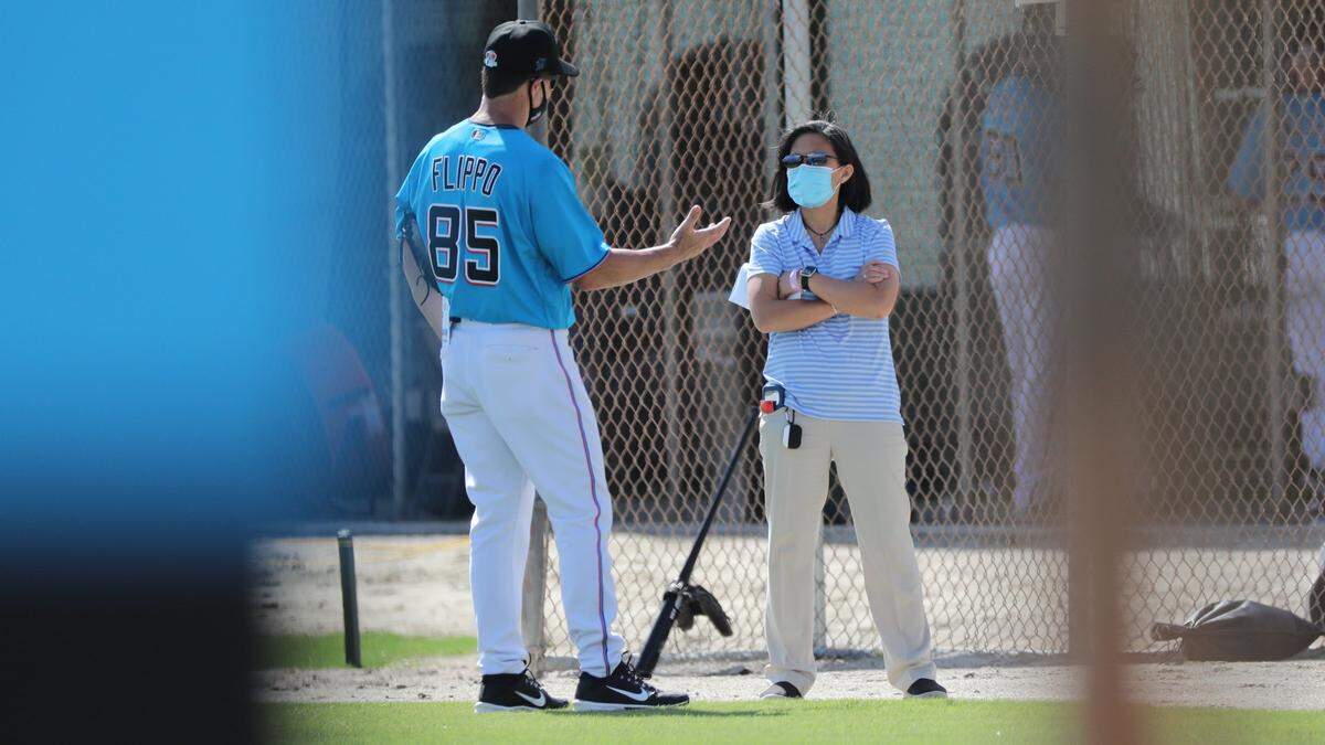 Miami Marlins bullpen coordinator Rob Flippo speaks with General Manager Kim Ng during Marlins spring training at the Roger Dean Chevrolet Stadium in Jupiter on Tuesday, February 23, 2021.