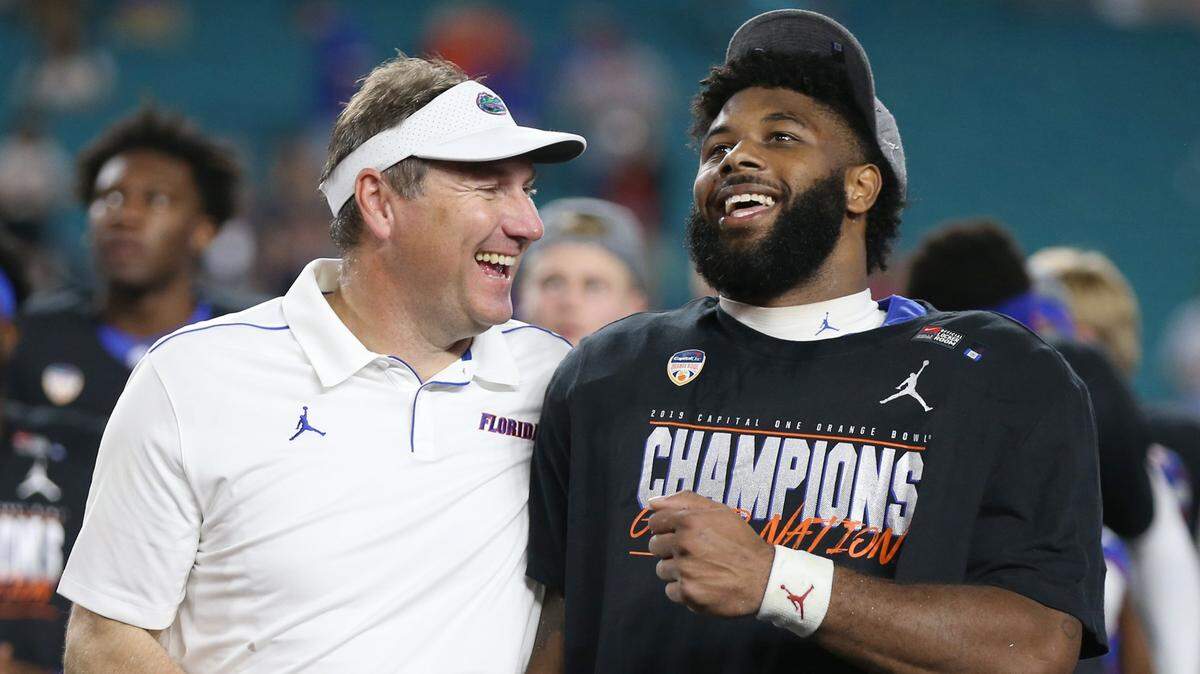 Florida Gators Florida Gators head coach Dan Mullen and MVP running back Lamical Perine (2) after the Florida Gators defeat the Virginia Cavaliers during the Capital One Orange Bowl at Hard Rock Stadium in Miami Gardens on Tuesday, December 31, 2019.