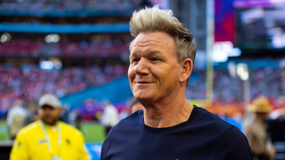Celebrity chef Gordon Ramsay on the sidelines before Super Bowl LVII at State Farm Stadium.