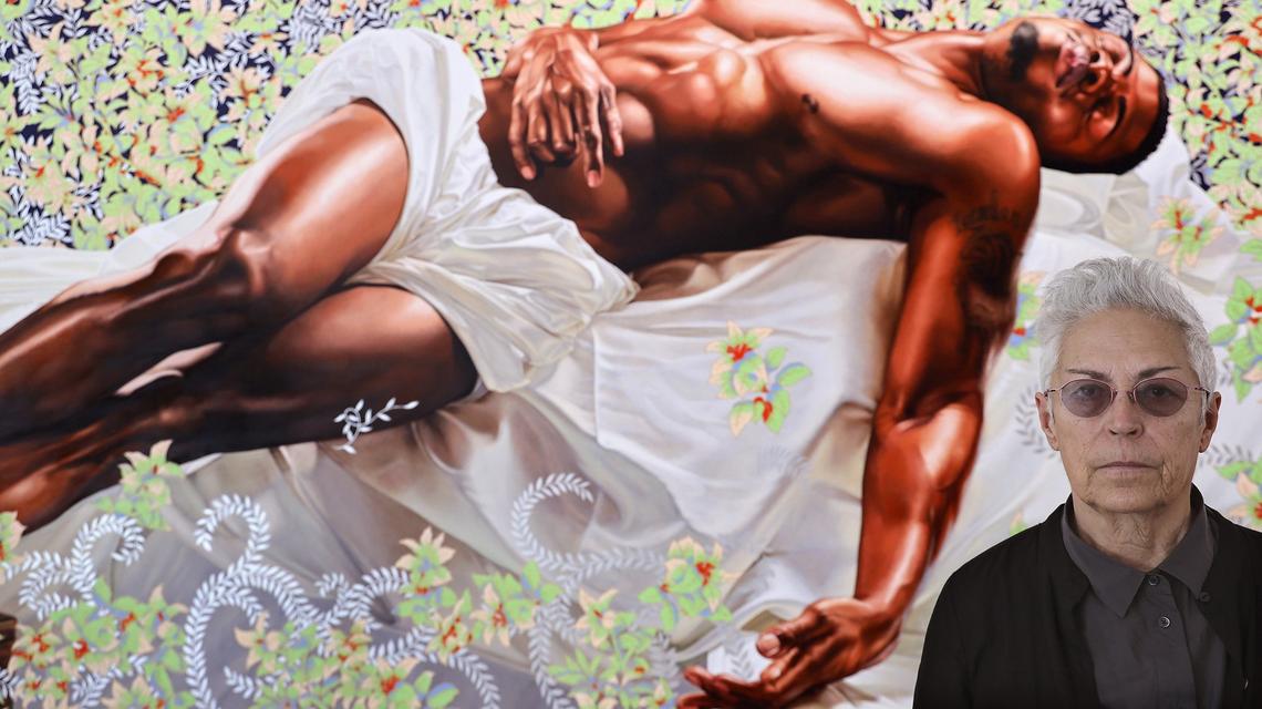 Art collector Mera Rubell stands before Kehinde Wiley’s oil on canvas painting “Sleep,” from 2008, as the new Rubell Museum in Miami’s Allapattah neighborhood prepares for its opening during Art Basel week.