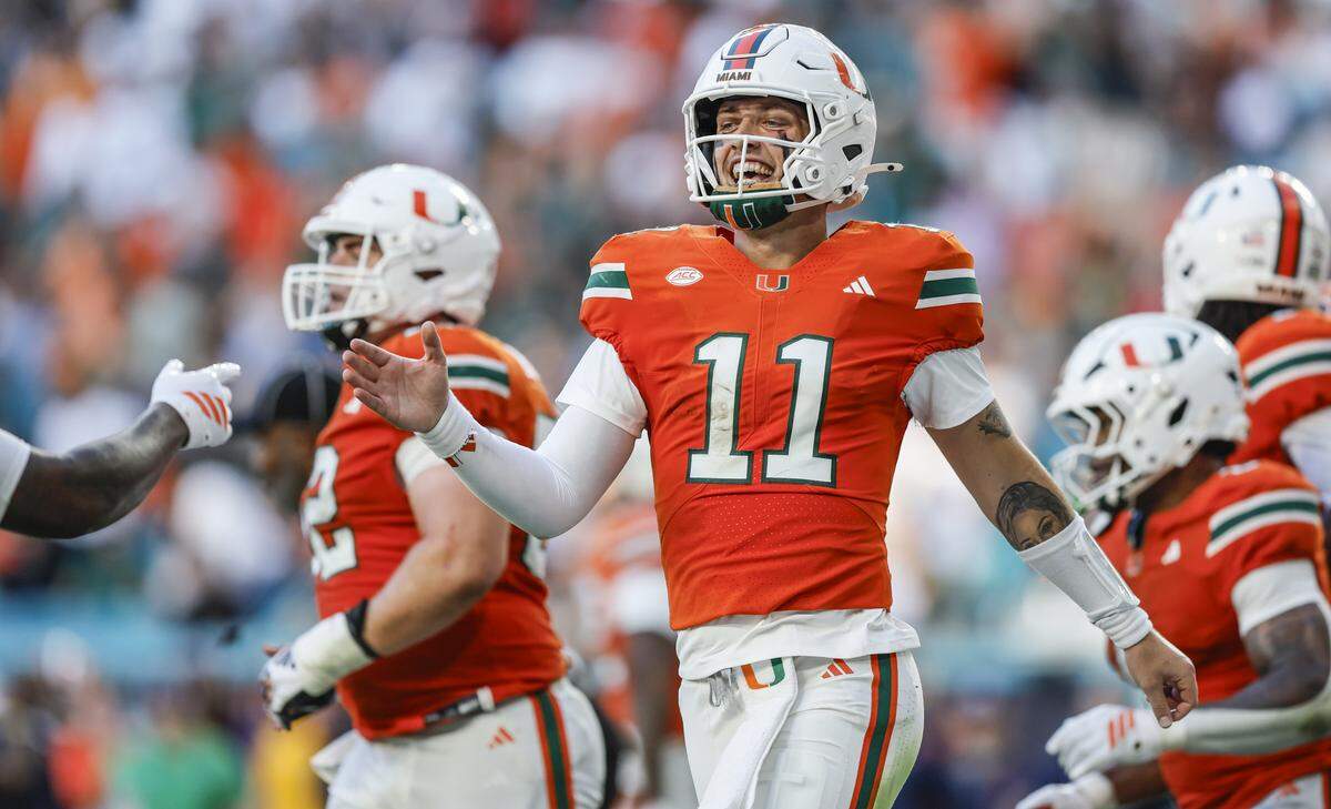 Miami Hurricanes quarterback Carson Beck (11) celebrates after scoring in the first half during an NCAA football game against Syracuse Orange at Hard Rock Stadium in Miami Gardens, Florida on Saturday, November 8, 2025.