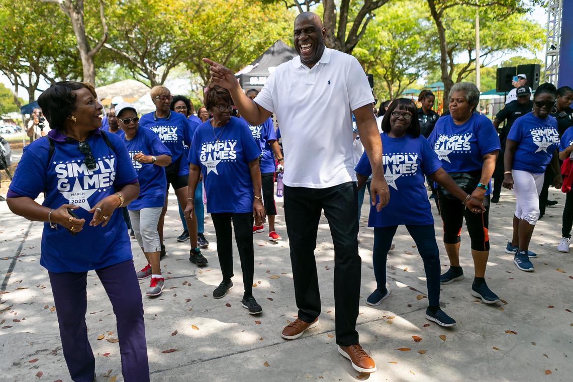 Earvin “Magic” Johnson dances with seniors during the Simply Games hosted by Simply Healthcare at Charles Hadley Park on Thursday, March 5, 2020. Johnson, a surprise guest at the event, arrived to encourage seniors to stay active and be healthy.