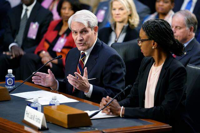 Judge Thomas Griffith, left, and Professor Lisa Fairfax, right, introduce Supreme Court nominee Judge Ketanji Brown Jackson during her confirmation hearing before the Senate Judiciary Committee Monday, March 21, 2022, on Capitol Hill in Washington.