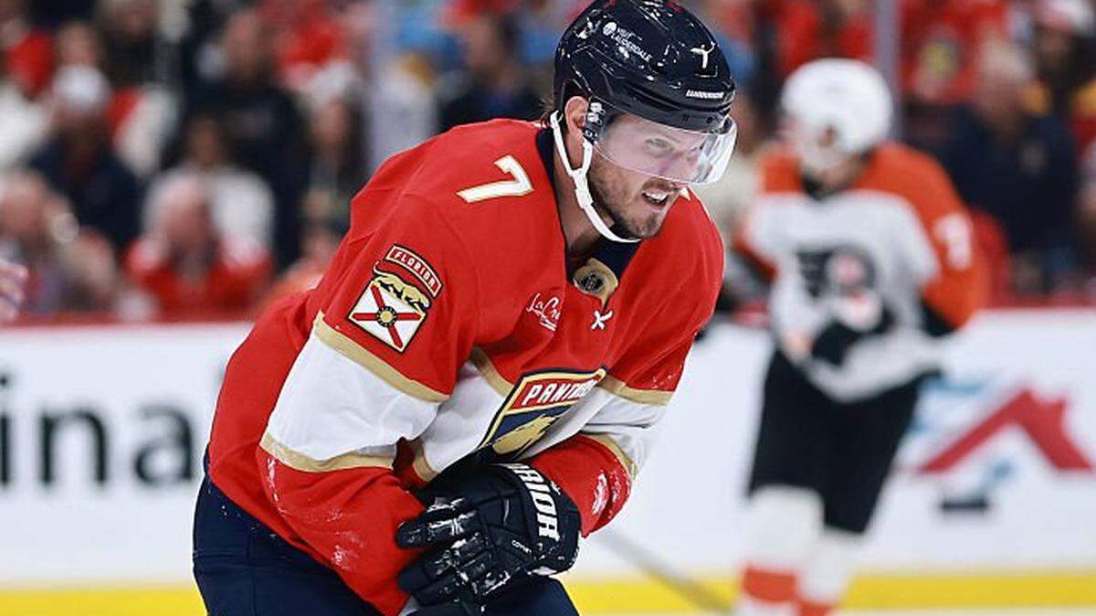 SUNRISE, FLORIDA - OCTOBER 09: Dmitry Kulikov #7 of the Florida Panthers skates off the ice gripping his arm against the Philadelphia Flyers during the second period at Amerant Bank Arena on October 09, 2025 in Sunrise, Florida. (Photo by Carmen Mandato/Getty Images)