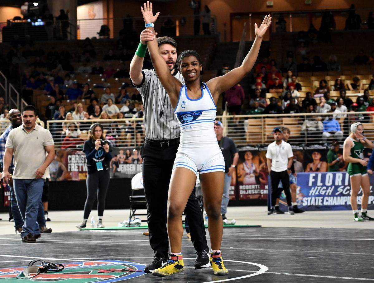 South Dade’s Willow White celebrates after winning the girls 120-pound state championship on Saturday at the FHSAA IBT wrestling state championships at Silver Spurs Arena in Kissimmee.