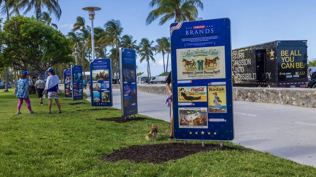 Attendees check the different images on display during the unveiling “ceremony of the Miami Beach FREEDOM" outdoor exhibition on Thursday May 21 at Galería Ocean Drive in Lummus Park (between 11th and 12th Streets) to commemorate America's 250th anniversary. The exhibit features 34 weatherproof panels honoring American icons and runs through July 15, 2026.
