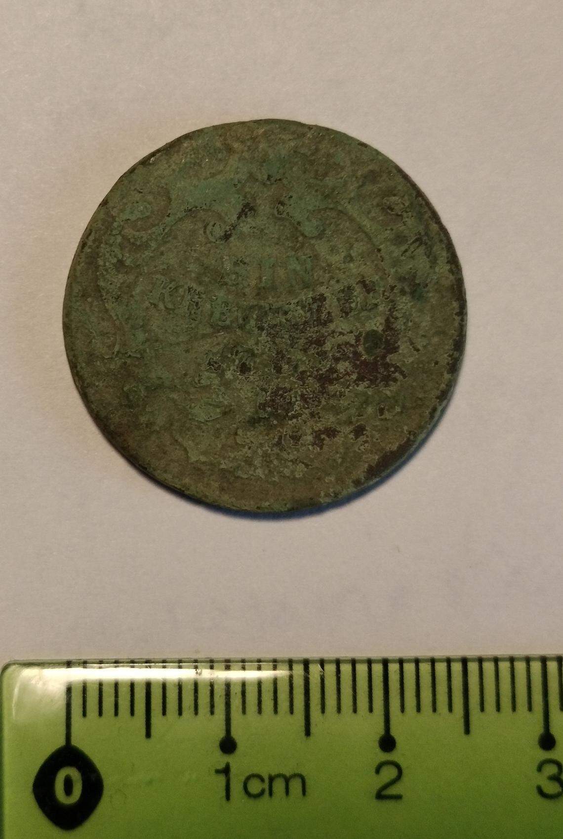 A coin from Austria that was minted in 1773.