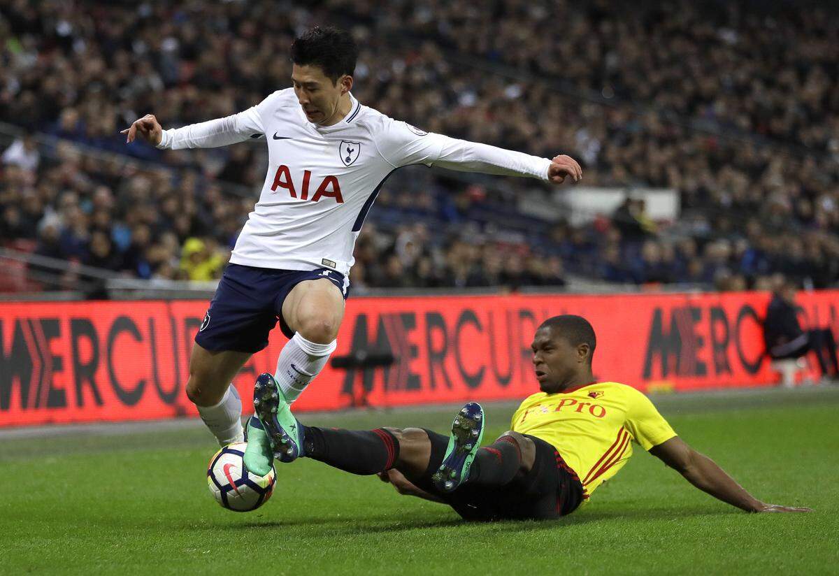 Tottenham's Son Heung-min vies for the ball with Watford's Christian Kabasele during the English Premier League soccer match between Tottenham Hotspur and Watford at Wembley stadium in London, Monday, April 30, 2018. (AP Photo/Kirsty Wigglesworth)