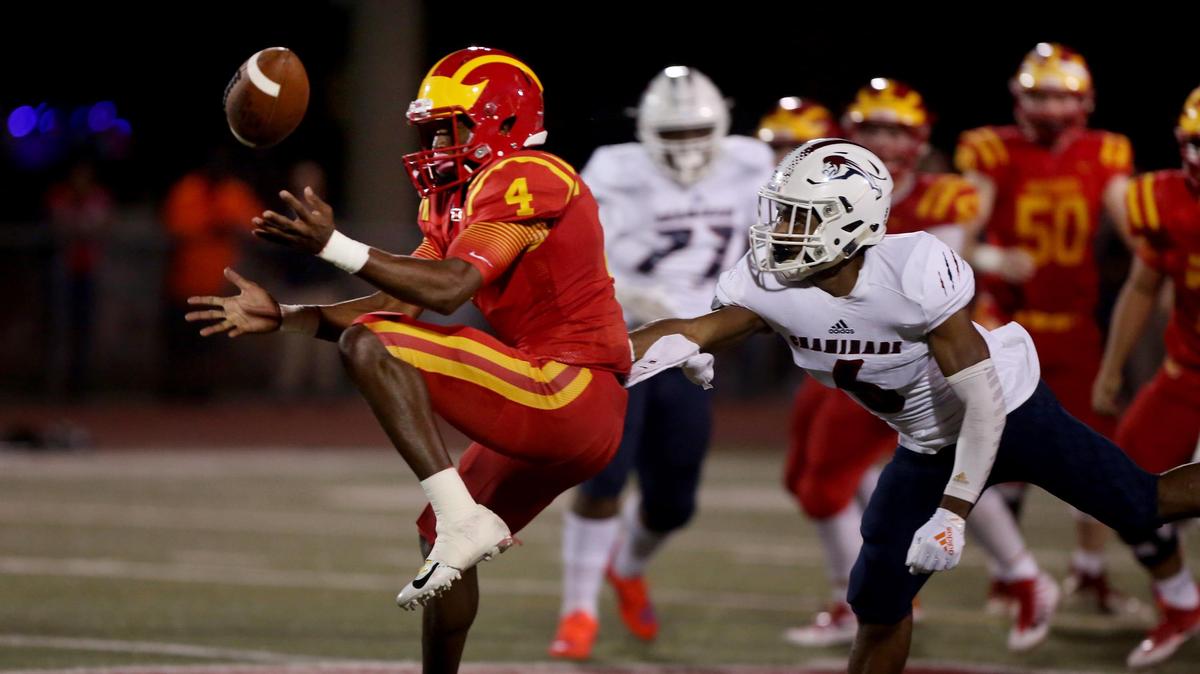 A pass intended for CCC’s Jerjuan Newton (4) misses long with Chaminade-Madonna’s Deidrick Stanley ll (6) defending, right, during the first half of Friday’s (11/30/18) state high school football semifinal: Class 3A: Hollywood Chaminade-Madonna at Clearwater Central Catholic, in Clearwater.