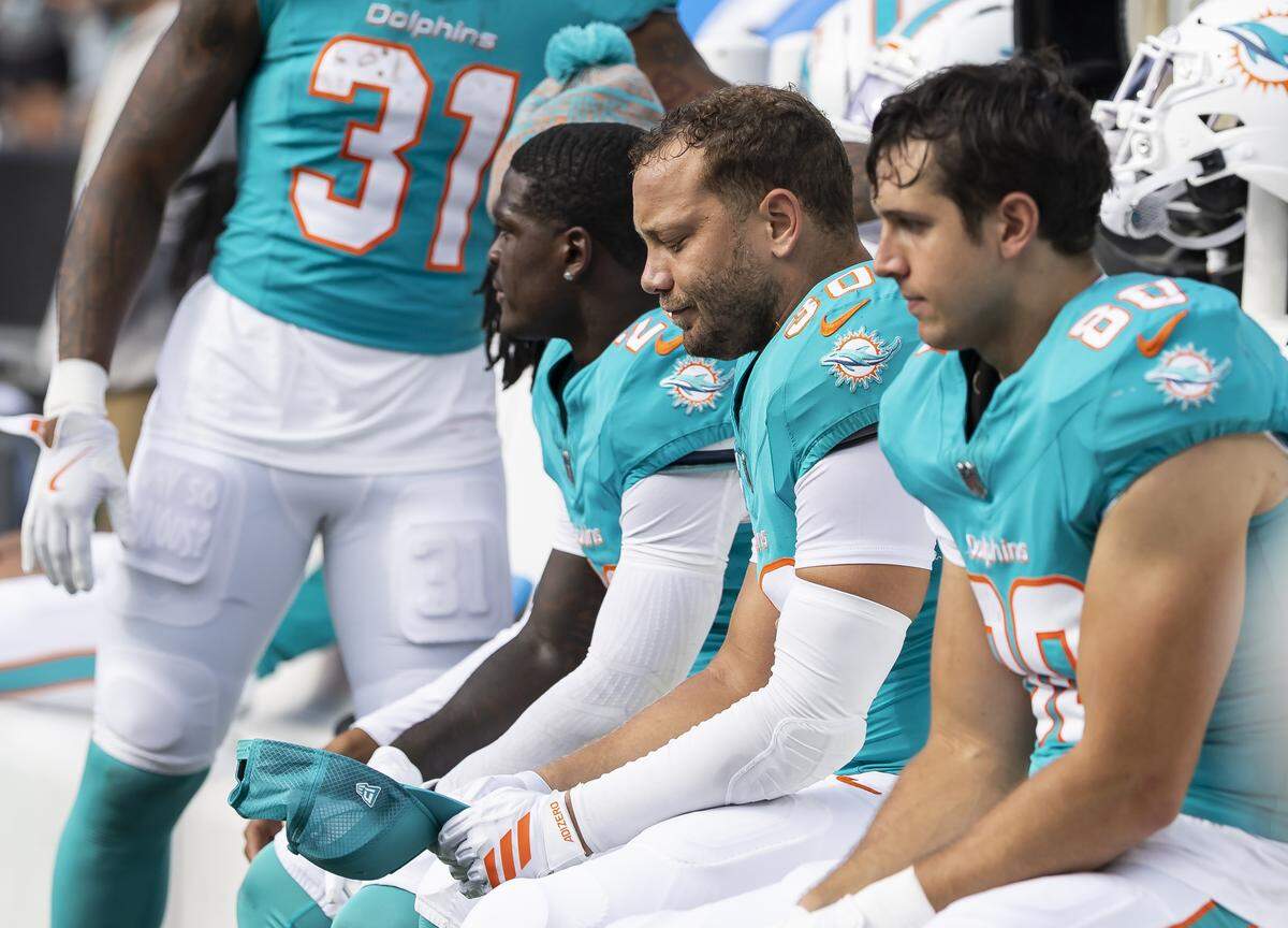 Miami Dolphins fullback Alec Ingold (30) reacts from the bench as his team loses against the Carolina Panthers in the second half of their NFL game at the Bank of America Stadium on Sunday, Oct. 5, 2025, in Charlotte, N.C.