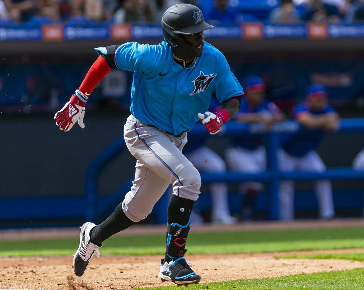 Miami Marlins Jazz Chisholm (70) singles on a ground ball to second base against the New York Mets during the fifth inning of a spring training MLB game at Clover Park in Port St. Lucie, Florida on Saturday, February 22, 2020.