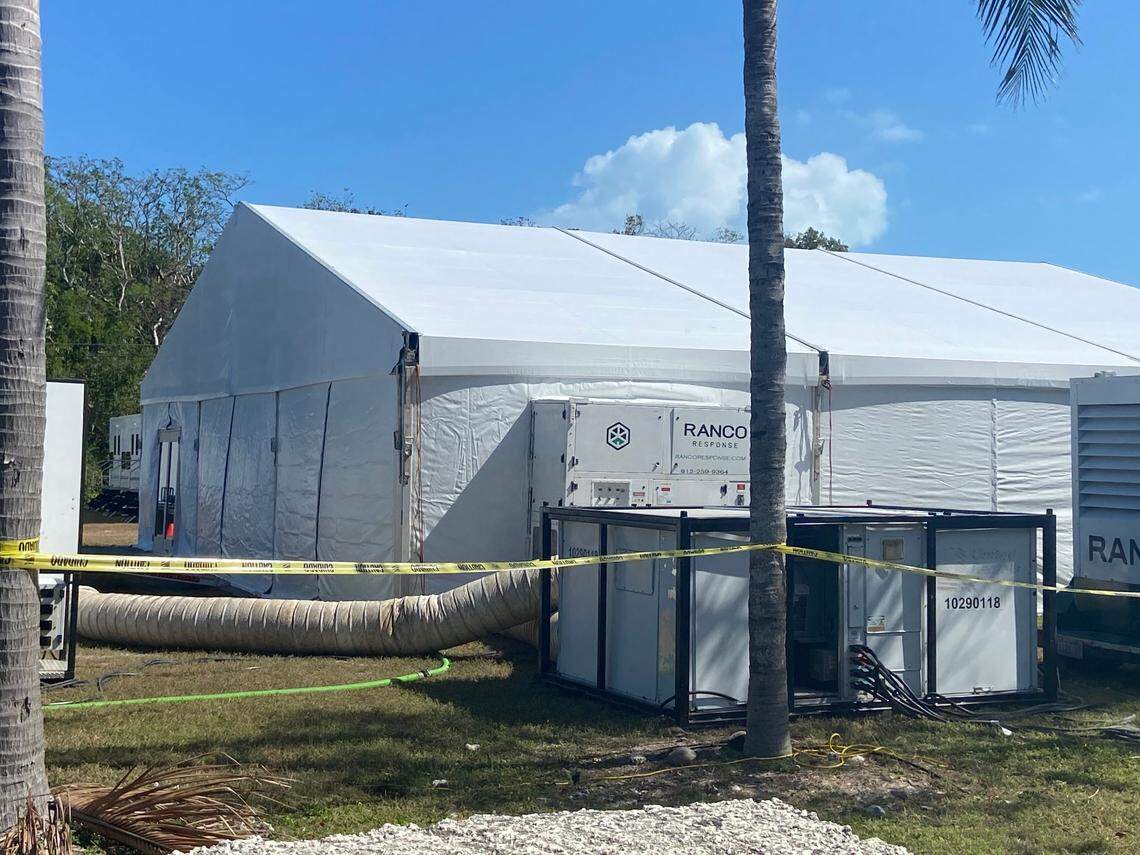 A large, air-conditioned tent is erected on a residential lot on Plantation Key, located within the Village of Islamorada in the Florida Keys, Thursday, Feb. 16, 2023. It’s part of a state base camp to house police officers sent to the Keys to help with an increase in maritime migration from Cuba and Haiti, according to a statement from the Village of Islamorada.