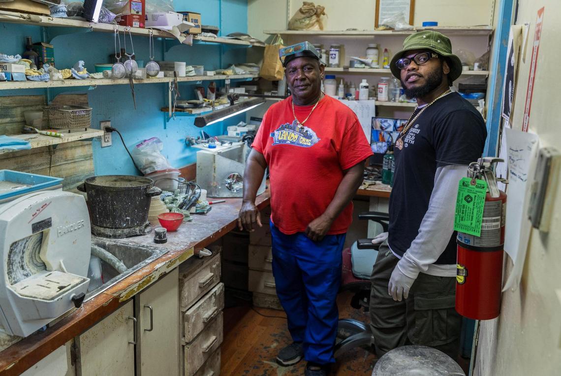 Orlando Plein and his son Phillip Norville at Lando Golds. Plein has created grillz for rappers like Kodak Black and has clients who fly in from around the world for his work. 