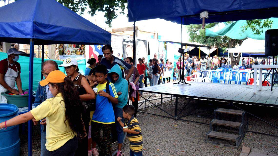 Venezuelans line up for free meals in Cucuta, Colombia. The U.S. Agency for International Development is helping fund the Catholic Church program, which feeds more than 2,700 people a day.
