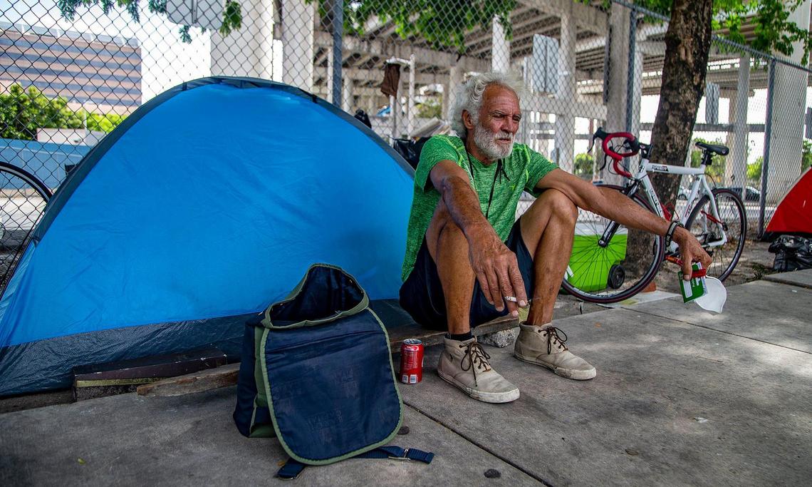 Daniel Chaviano, a homeless man living under the I-95 underpass in downtown Miami, sits by his tent after being vaccinated by medical staff with the Miami-Dade County Homeless Trust, which teamed up with the Florida Division of Emergency Management to conduct vaccination tours throughout unsheltered homeless hot spots and shelters across Miami-Dade.