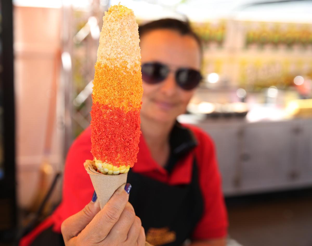 Twistd Spicy Corn slathered in spicy mayo and sprinkled in a rainbow of three toppings: toasted parmesan cheese, crushed jalapeño-cheddar Cheetos and Flamin’ Hot Cheetos. The cost for the corn is $8 and can be found at location 222.
