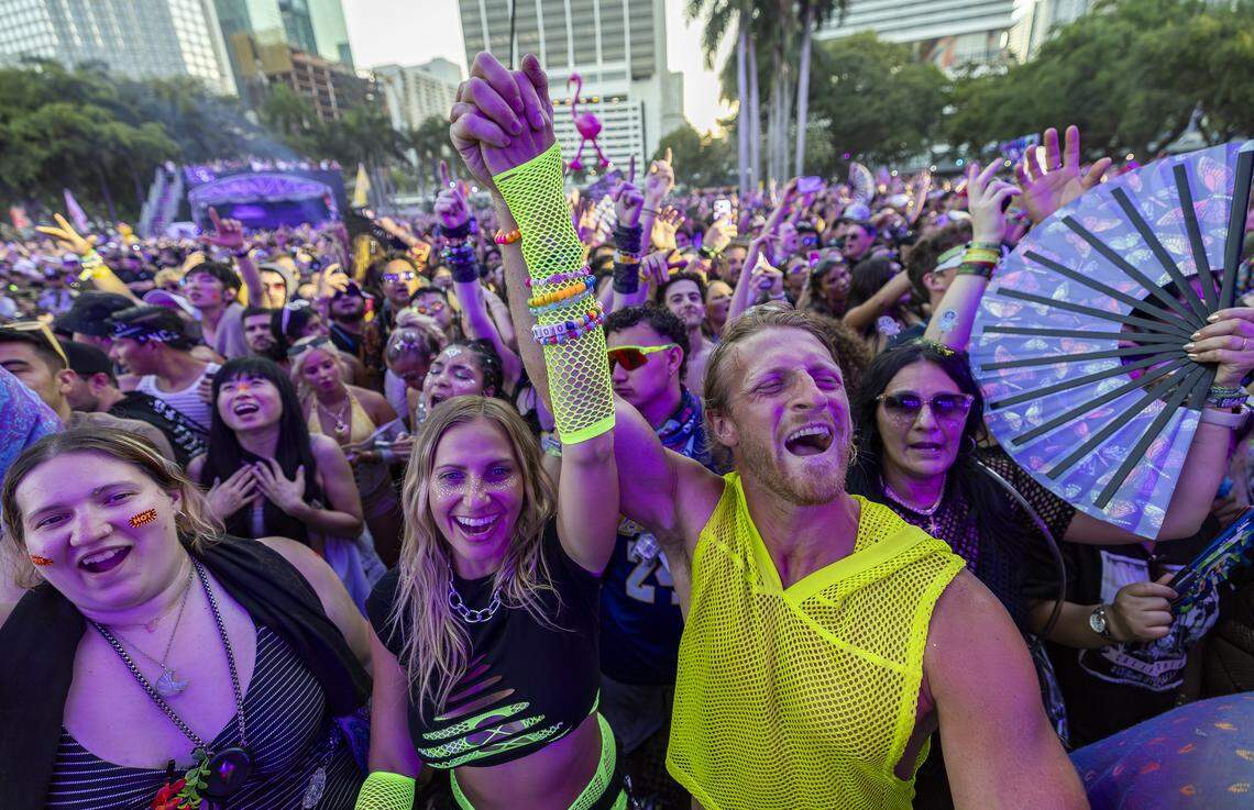 Kescily Fairbanks, center, and Frank Chipolone react as Steve Aoki performs during Ultra Music Festival’s 26th anniversary at Bayfront Park on Saturday, March 28, 2026, in downtown Miami, Fla.