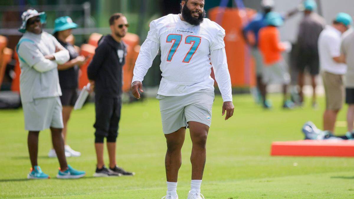 Miami Dolphins offensive tackle Isaiah Wynn (77) works out during training camp at Baptist Health Training Facility in Miami Gardens, Florida, Thursday, July 27, 2023.