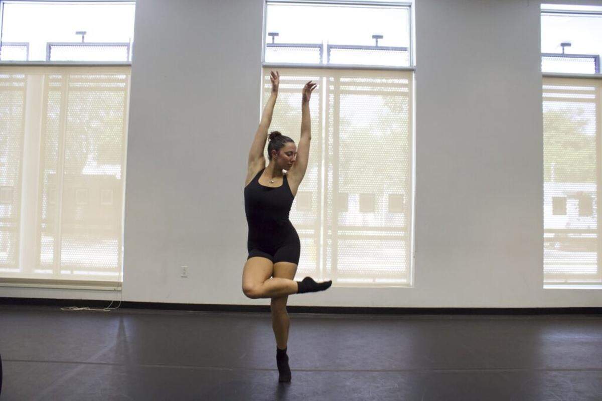 Julia Faris tall at the center of her own journey in rehearsal for “Traces.”