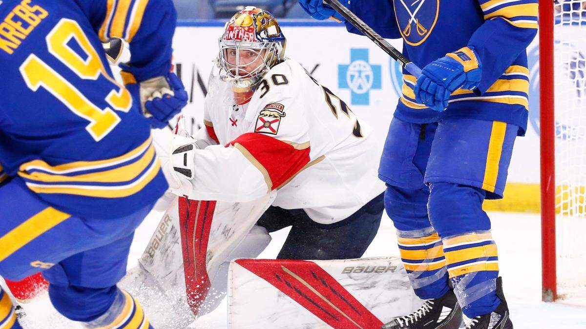Florida Panthers goaltender Spencer Knight (30) looks for the puck in traffic during the first period of an NHL hockey game against the Buffalo Sabres, Monday, March 7, 2022, in Buffalo, N.Y. (AP Photo/Jeffrey T. Barnes)