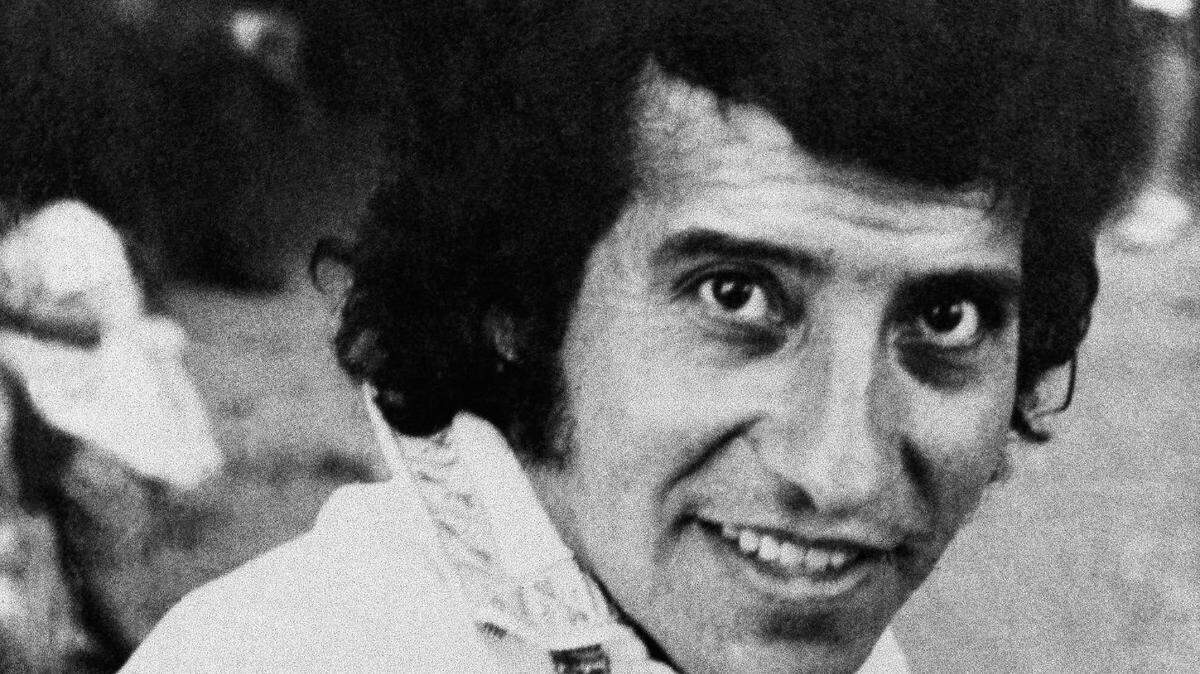 FILE - In this undated file photo, singer and songwriter Victor Jara poses for a photo in Chile. A Chilean court on Friday, Dec. 28, 2012, charged eight former army lieutenants in the killing of Jara almost four decades ago. Jara was detained along with many others at Chile’s State Technical University the day after the Sept. 11, 1973 coup that toppled President Salvador Allende. His body was found several days later, riddled with bullets and bearing signs of torture. The killing transformed Jara into a symbol of struggle against Latin America’s military right-wing dictatorships. (AP Photo, File)