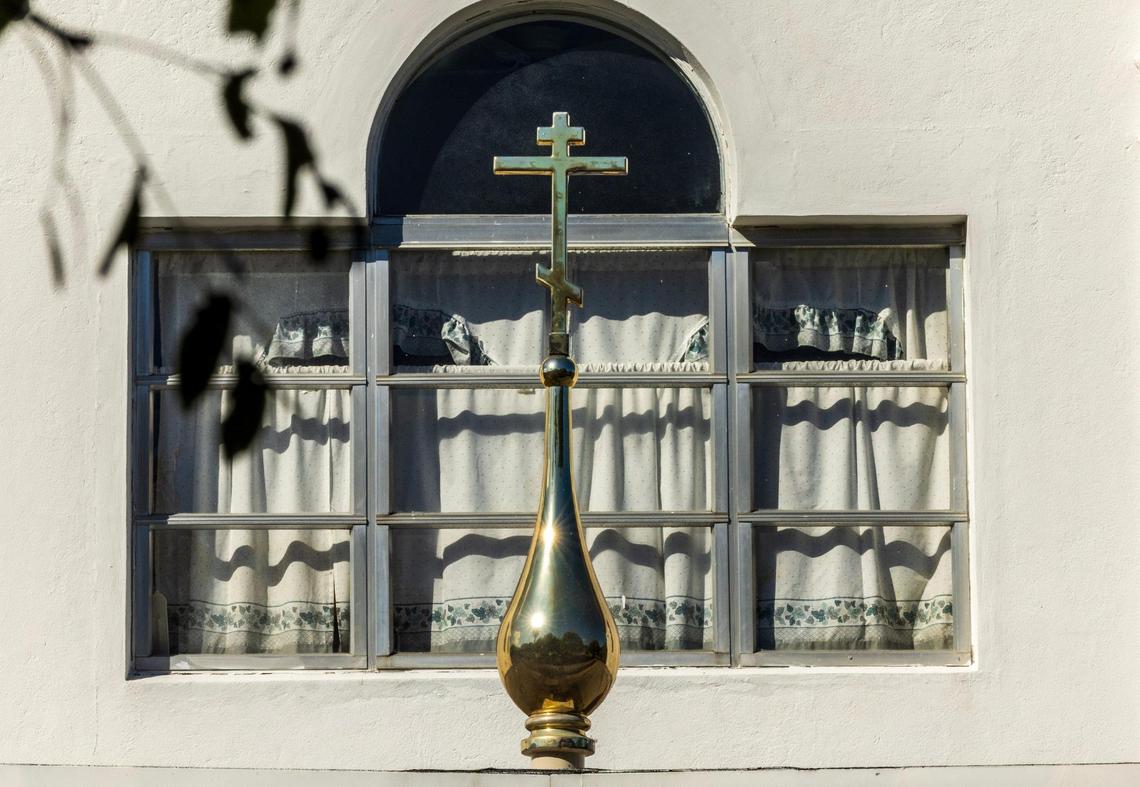 View of the Orthodox cross on the porch roof at the Saints Peter and Paul Russian Orthodox Greek Catholic Church in Little Havana. The church is caught up in a bitter legal dispute with the Orthodox Church in America about who owns the property.