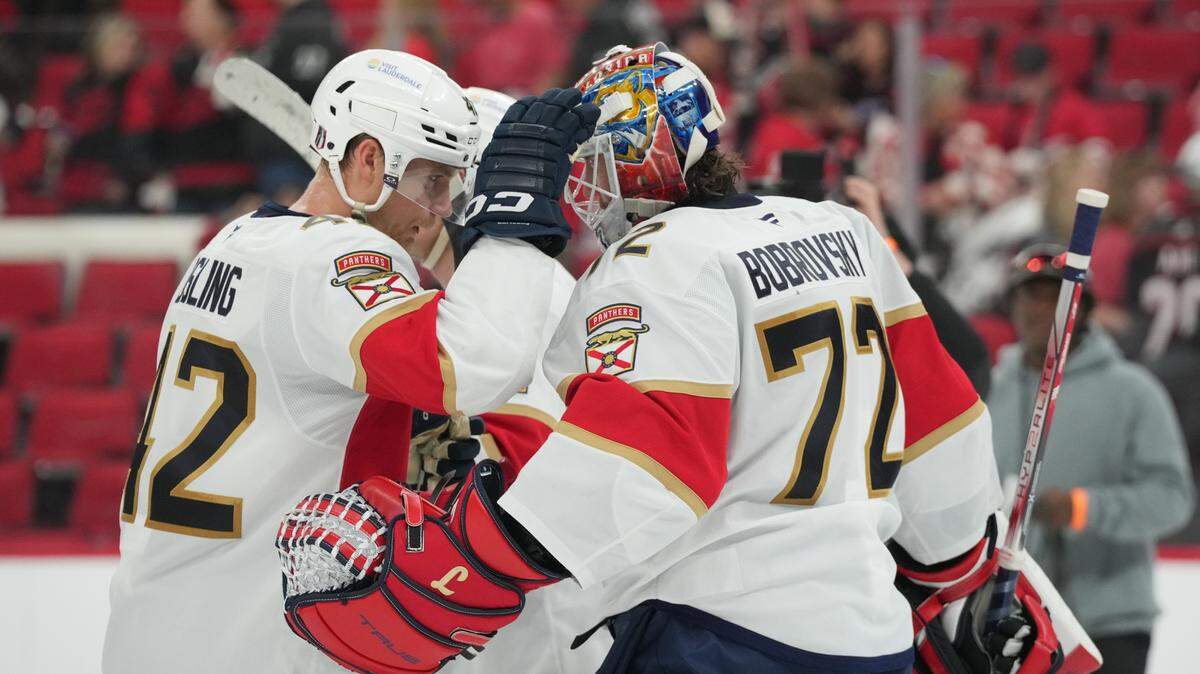 May 20, 2025; Raleigh, North Carolina, USA; Florida Panthers defenseman Gustav Forsling (42) celebrates with goaltender Sergei Bobrovsky (72) after the in against the Carolina Hurricanes in game one of the Eastern Conference Final of the 2025 Stanley Cup Playoffs at Lenovo Center. Mandatory Credit: James Guillory-Imagn Images