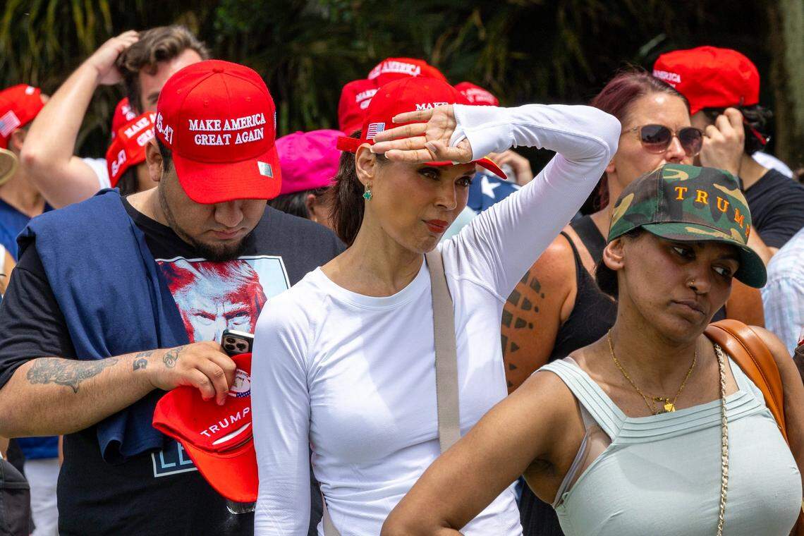 Trump supporters stand in line for water before the start of a rally at Trump National on Tuesday, July 9, 2024, in Doral, Fla.