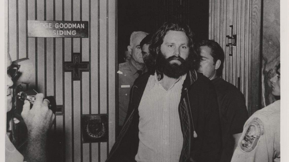 Jim Morrison leaves a Miami courtroom. The lead singer of the Doors was on trial, accused of lewd and lascivious behavior, drunkenness, profanity and indecent exposure during a concert at Dinner Key Auditorium in Miami in 1969.