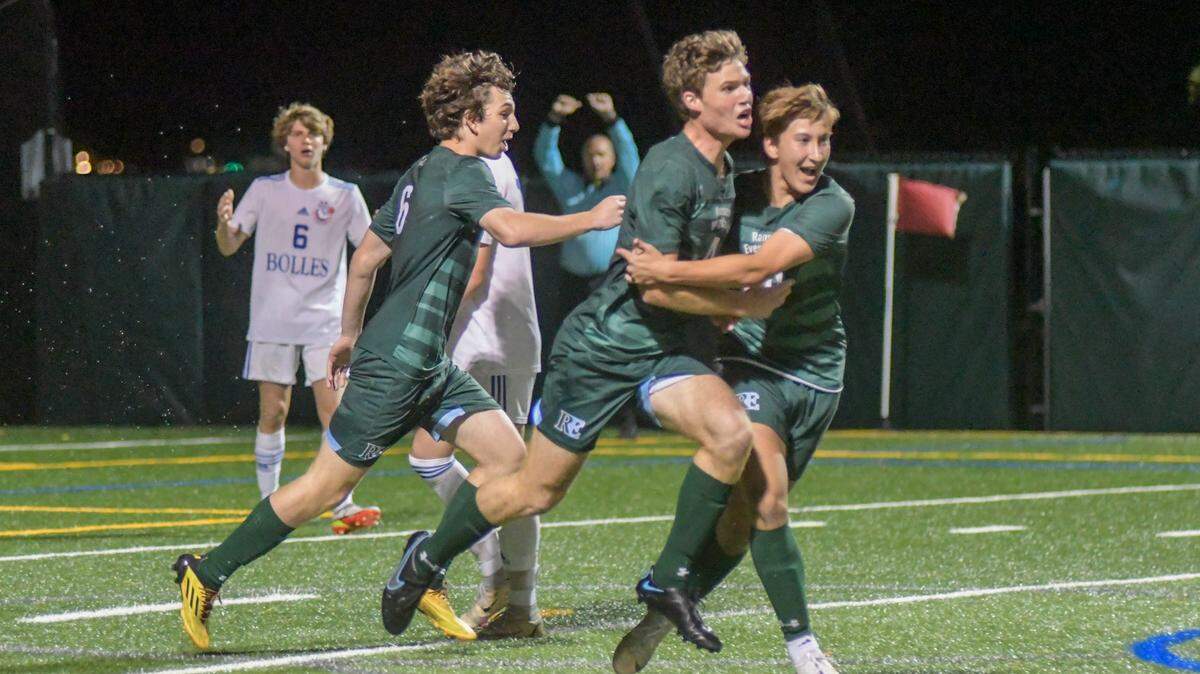Ransom Everglades defender Rylan Sadler (middle) celebrates with teammates after scoring a goal in the first half of a state semifinal against Jacksonville Bolles on Saturday, Feb. 19, 2022.