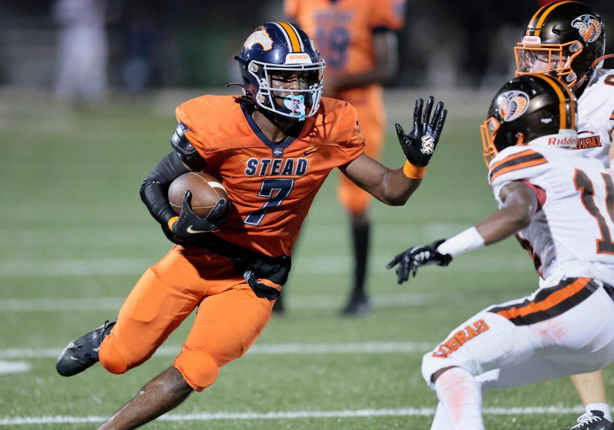 Homestead Broncos running back Ryan Bullard (7) carries the ball for a first down against the South Miami Cobras at Harris Field in Homestead, Florida on Friday, September 30, 2022.