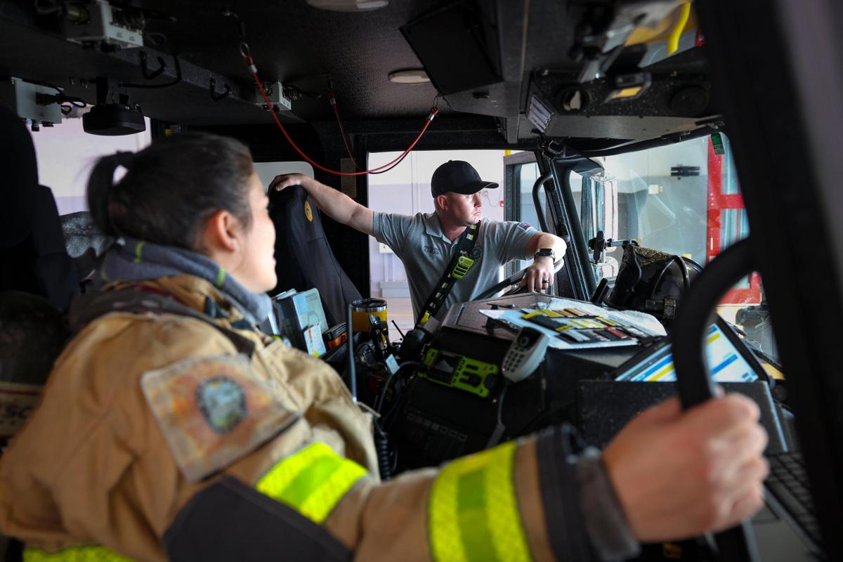 Lt. Veronica Cordoba, who leads the crew, left, talks with Chris Carlson, driver operator, before they run a training exercise with their fire engine crew during a shift on Thursday, April 3, 2025, at Dolphin Station 68 in Sweetwater, Florida. Property taxes go toward public safety expenses like the fire department.