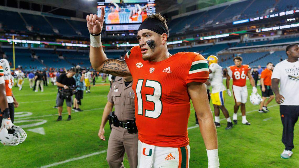 Miami Hurricanes quarterback Jake Garcia (13) walks off the field after the Hurricanes lost to the Pittsburgh Panthers 16-42 during an ACC conference football game at Hard Rock Stadium on Saturday, November 26, 2022 in Miami Gardens, Florida.