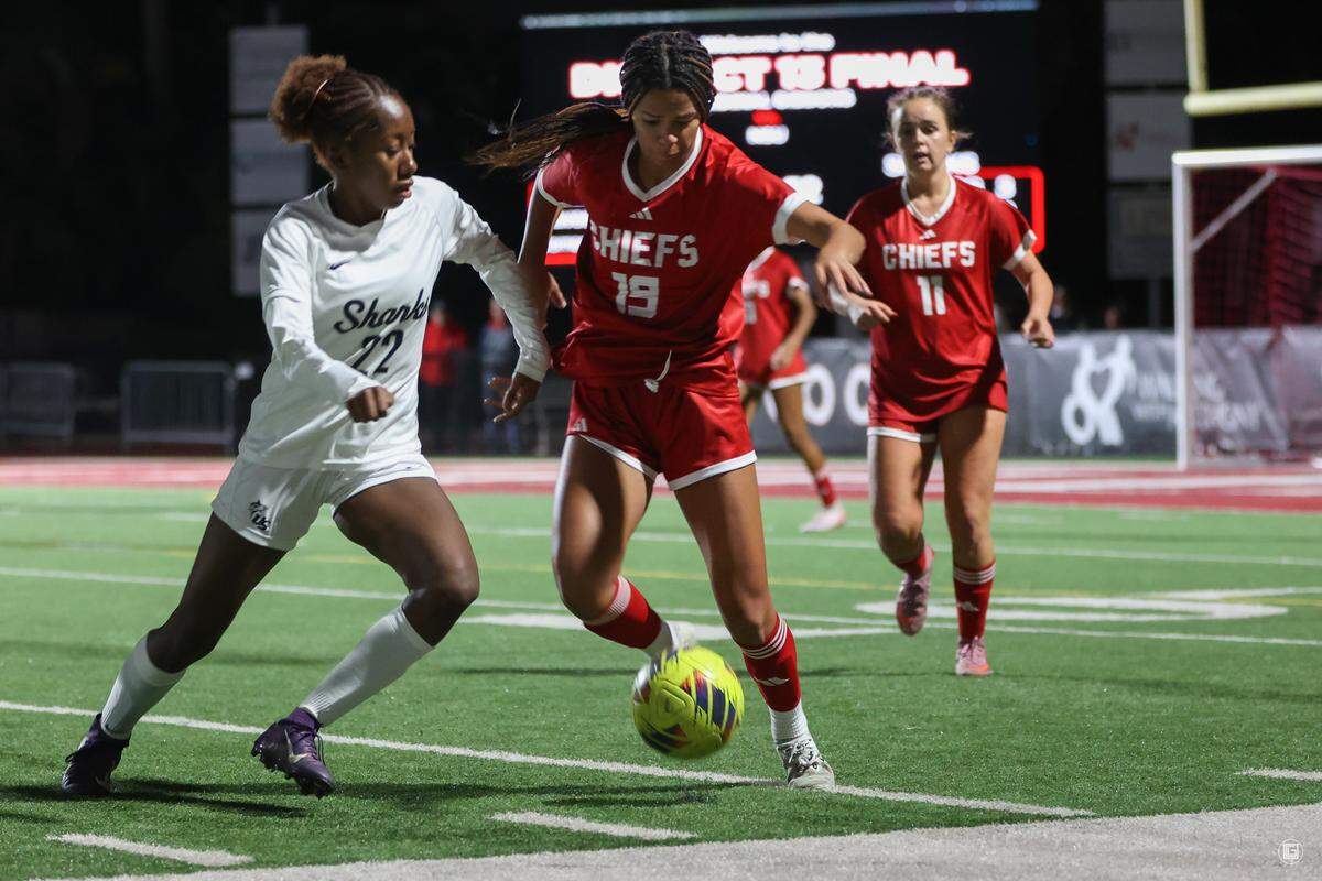 Cardinal Gibbons’ Reagan Hood (middle) battles for possession during the Chiefs’ recent win over NSU University School in the District 13-3A final.