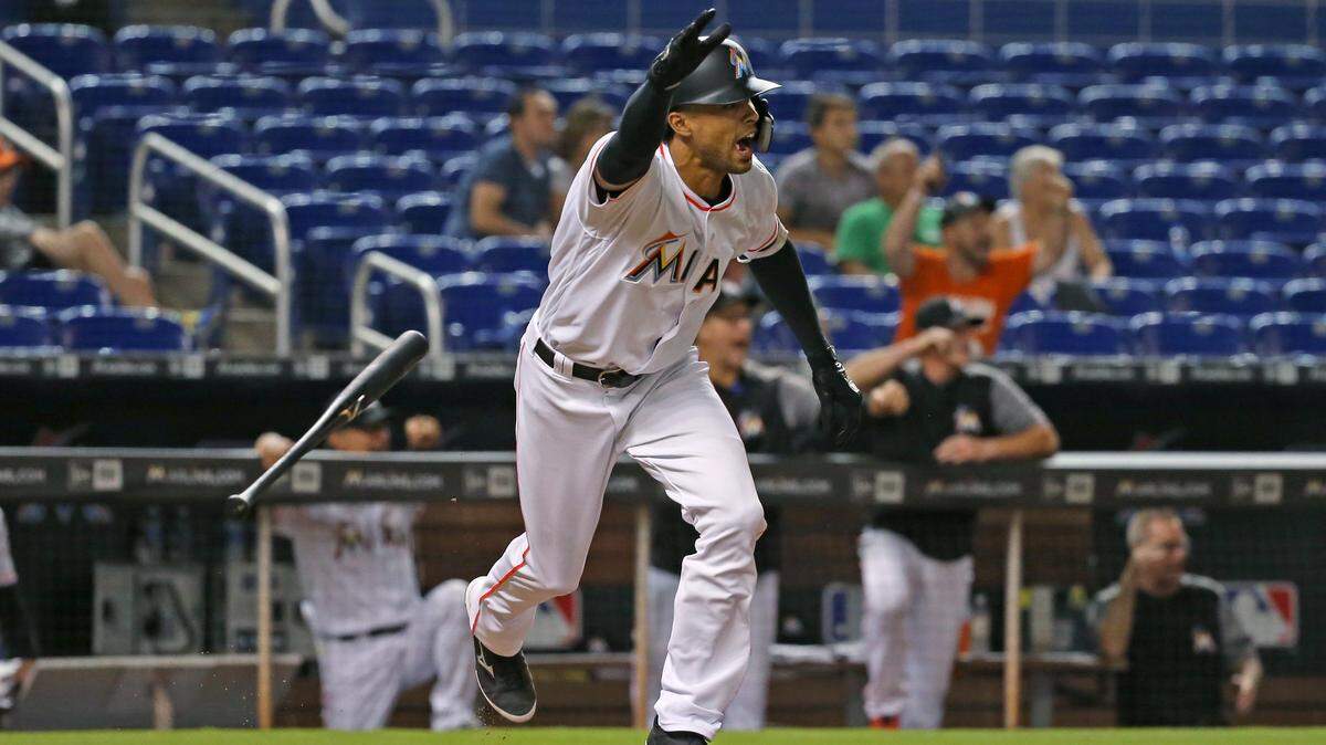 Miami Marlins pinch hitter Yadiel Rivera reacts after hitting a walk-off single during the tenth inning inning of a Major League Baseball game against the Philadelphia Phillies at Marlins Park on Tuesday, May 1, 2018.