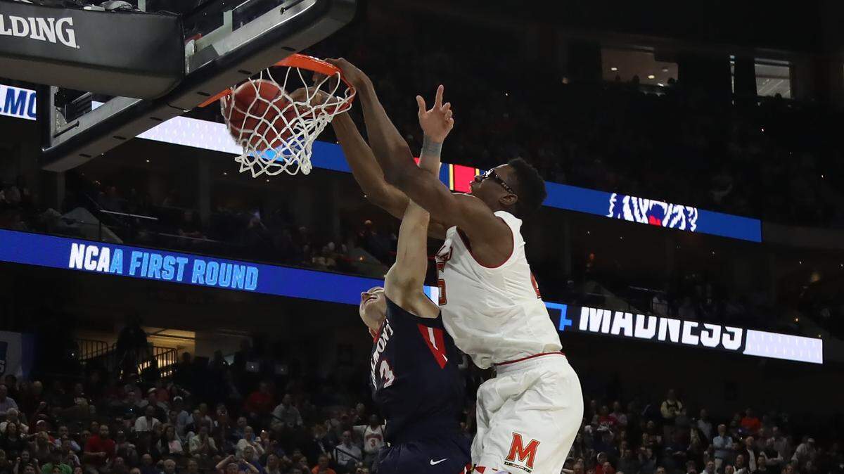Jalen Smith #25 of the Maryland Terrapins makes the slam dunk over Dylan Windler #3 of the Belmont Bruins in the second half during the first round of the 2019 NCAA Men’s Basketball Tournament at VyStar Jacksonville Veterans Memorial Arena on March 21, 2019 in Jacksonville, Florida.