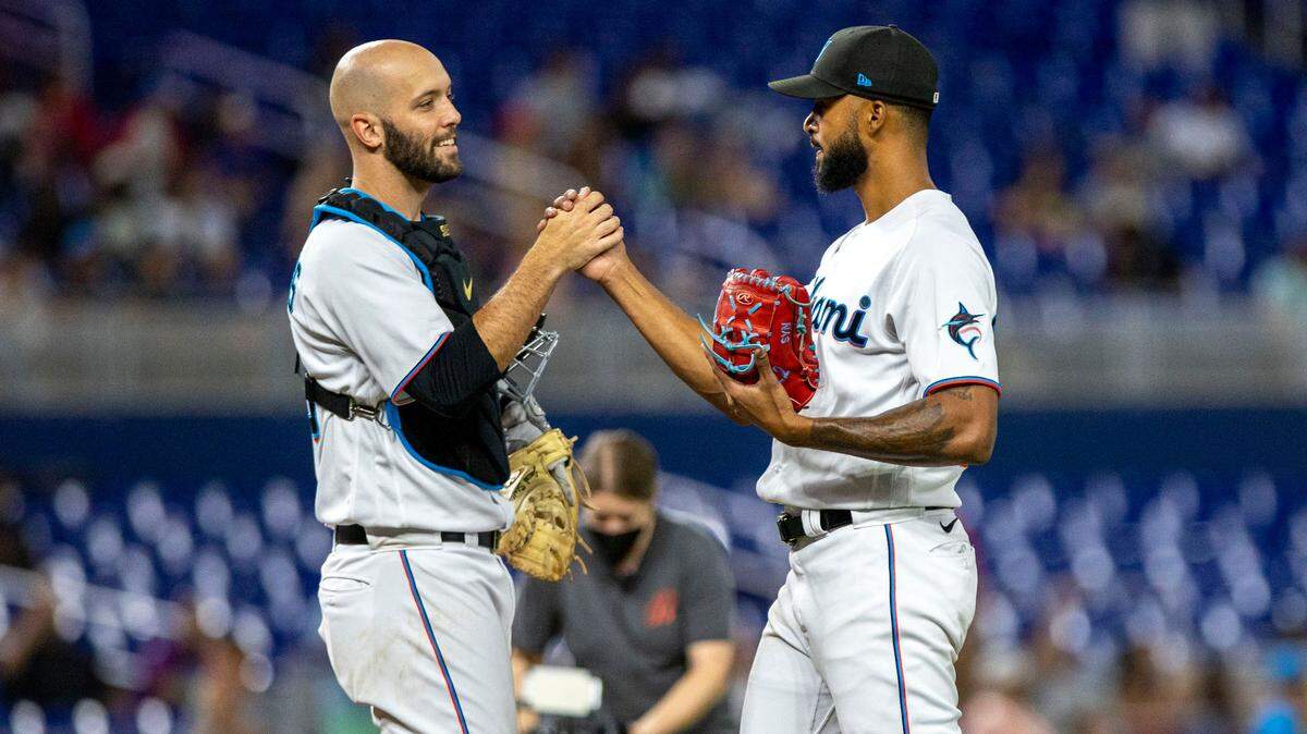 Miami Marlins pitcher Sandy Alcantara (22) reacts with catcher Jacob Stallings (58) after the Marlins defeated the Cincinnati Reds 3-0 in nine innings of an MLB game at loanDepot park in the Little Havana neighborhood of Miami, Florida, on Wednesday, August 3, 2022.