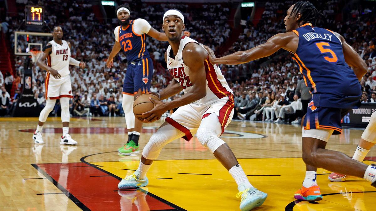 Miami Heat forward Jimmy Butler (22) drives to the basket as New York Knicks guard Immanuel Quickley (5) defends in the second quarter in Game 3 of the NBA Eastern Conference Semifinals at the Kaseya Center in Miami on Saturday, May 6, 2023.