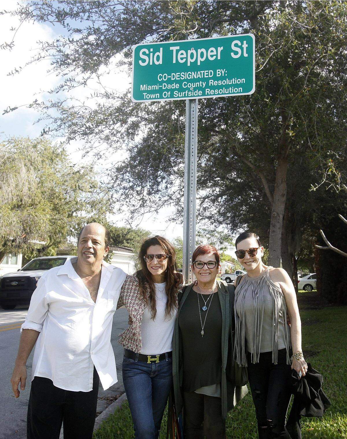 Four of songwriter Sid Tepper’s children-- Brian Tepper, left, Jackie Tepper, Susan Tepper, and Michelle Tepper - pose for photos at the new Town of Surfside street sign designating 89th Street at Irving Avenue as Sid Tepper Street on Dec. 16, 2016. The Tepper siblings (brother Warren Tepper could not attend) joined dozens of family, friends and officials at the street designation ceremony to honor their father. Sid Tepper composed the song ‘Red Roses For a Blue Lady’ and many other popular tunes. He died in 2015 at age 96. Tepper lived in Surfside for more than 40 years, and most recently at Williams Island in Aventura. The street renaming extends several blocks along 89th Street (now Sid Tepper Street) east to Harding Avenue.