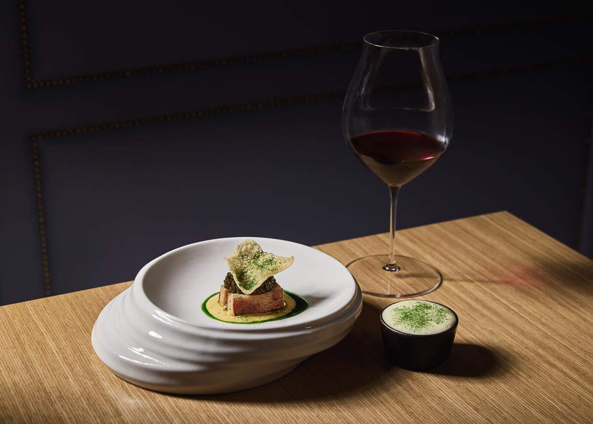 Porcelet and caviar with rose apple, yukon espuma and potato chicharron at Tambourine Room.