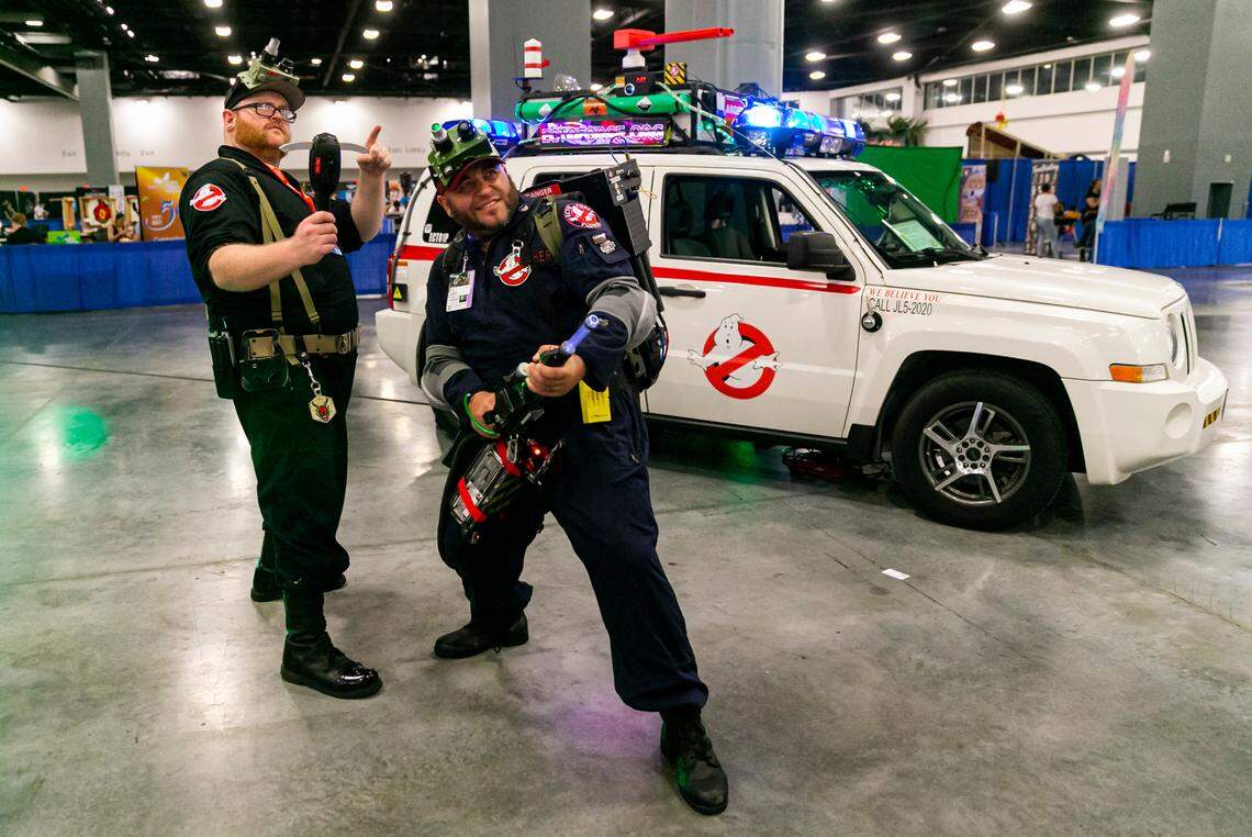 Tim “Crispy” Fries, left, and Tyler Pitcher cosplay as Ghostbusters during Florida Supercon.